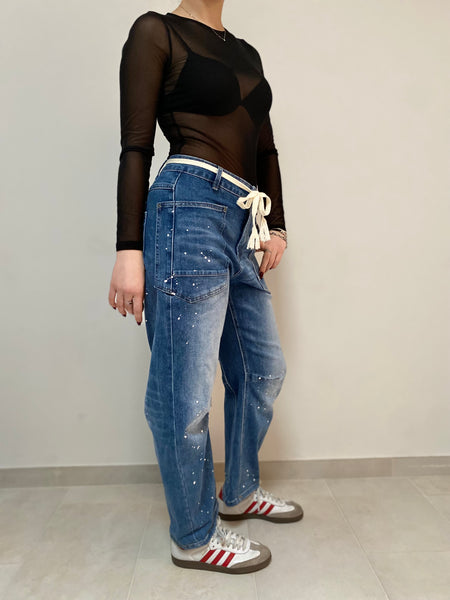 Denim spruzzato stretch fitting a banana da XS a L